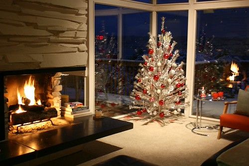 A cozy room warmed by a glowing fireplace