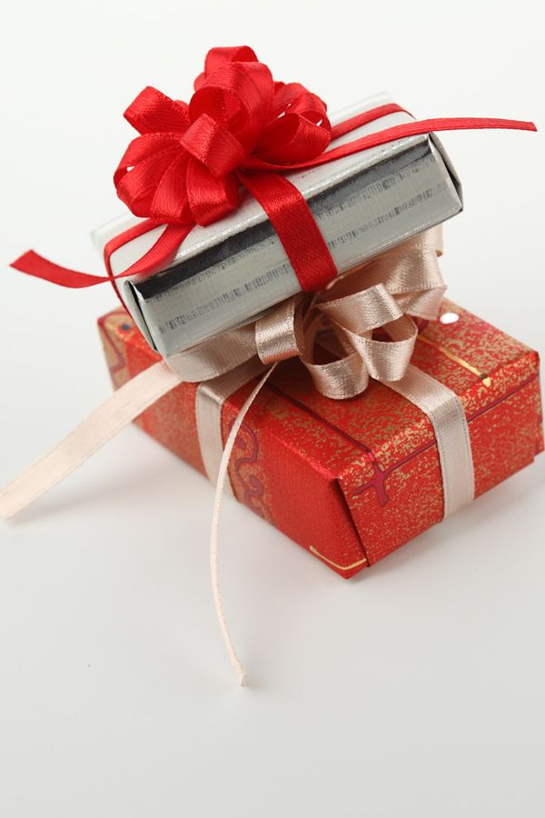 The Comfort Gift Box wrapped in red with ribbon